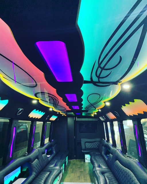 Luxury party bus interior with colorful LED lighting